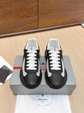 Prada unisex sneakers in black with white laces and white side stripes