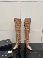 YSL taupe knee-high leather boots with stiletto heel, paired on display stand