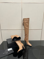 YSL taupe knee-high boot with stiletto heel, plus black slide-style shoe