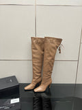 YSL taupe knee-high leather boots with stiletto heel and tassel tie detail