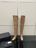 YSL taupe knee-high boots with stiletto heel and tassel tie detail, front view