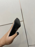 YSL taupe boot sole close-up with block stiletto heel and black interior