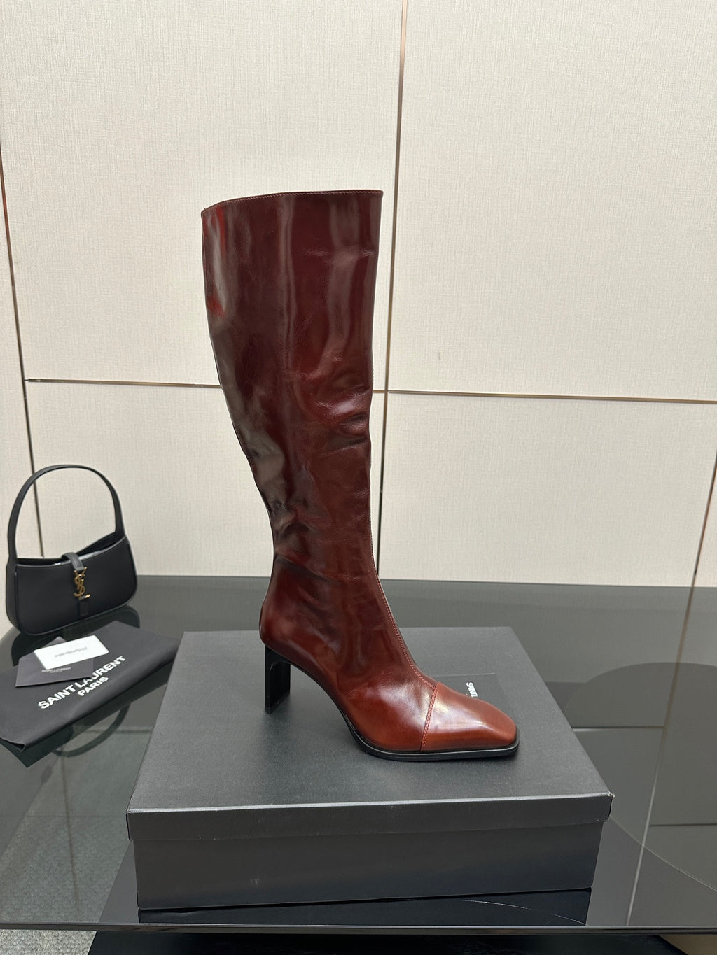 YSL ladies knee-high boots in dark burgundy glossy leather with slim stiletto heel