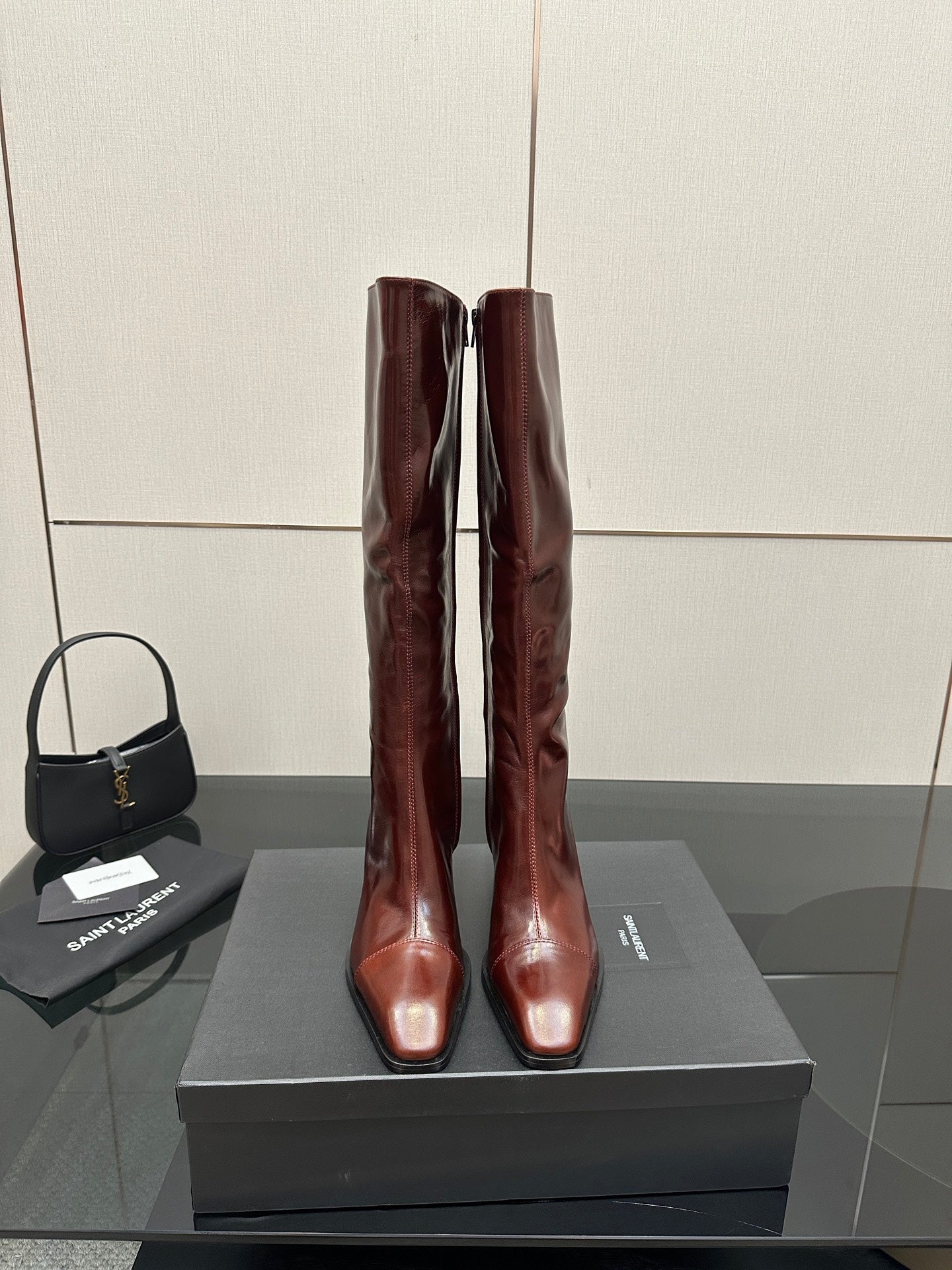 YSL ladies knee-high boots in dark burgundy glossy leather, slim stiletto heel
