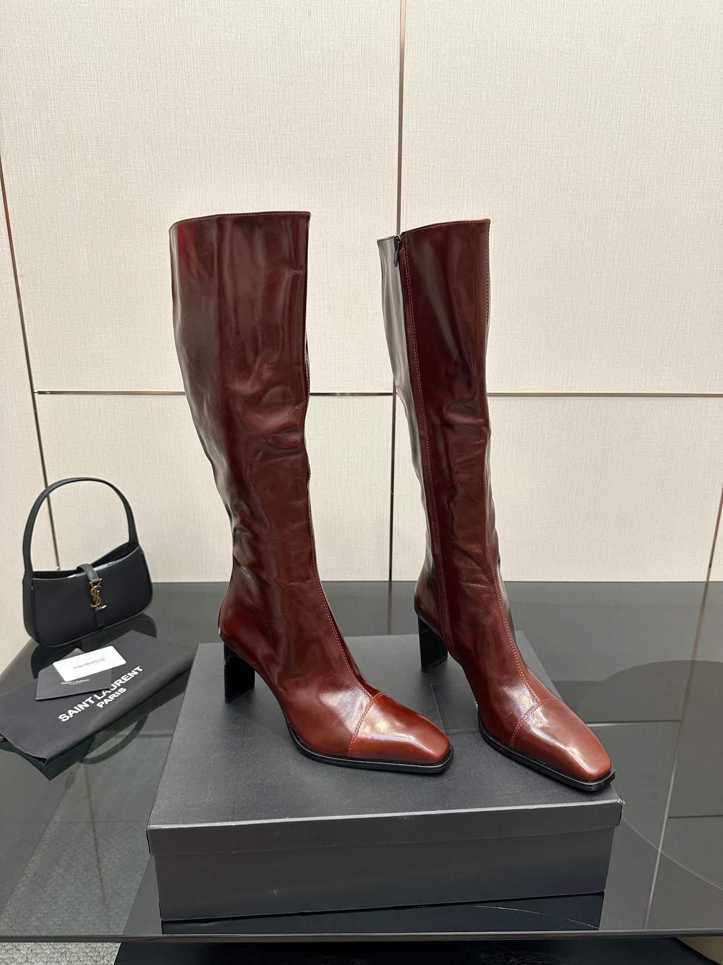 YSL ladies knee-high boots in dark burgundy glossy leather with slim stiletto heel