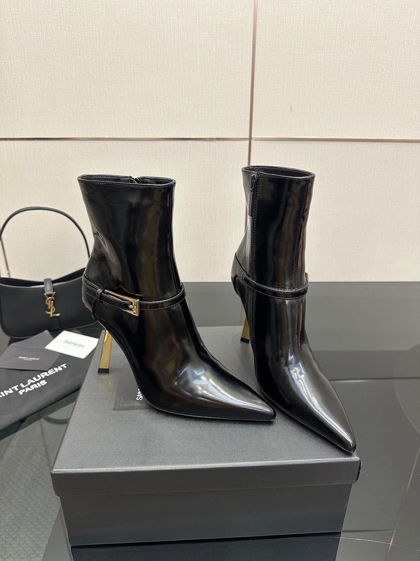 YSL ladies ankle boots with gold buckle strap, black glossy finish and high heel