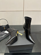 YSL ladies ankle boots, black glossy leather, pointed toe and gold buckle detail