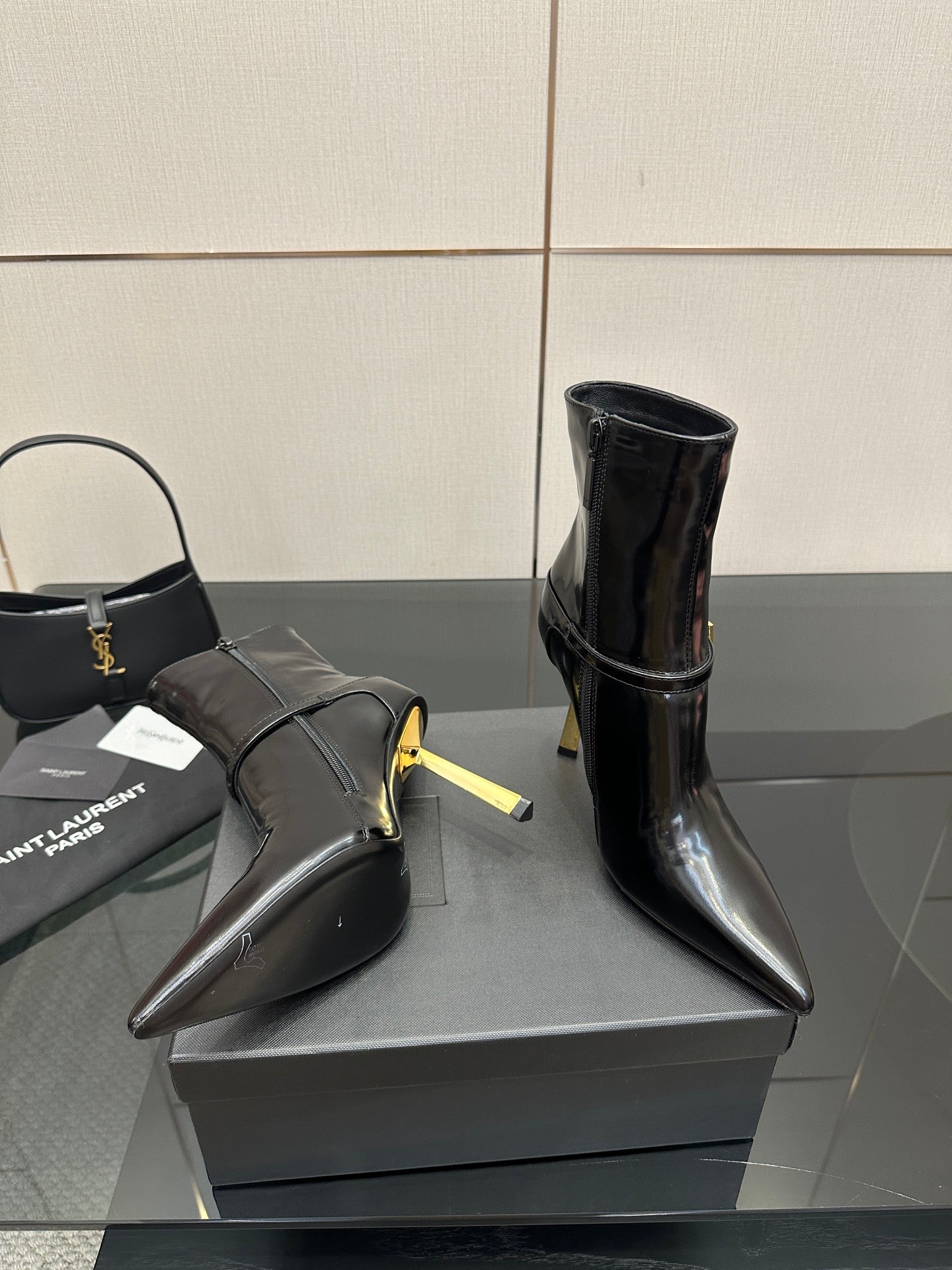 YSL ladies ankle boots, black glossy leather, pointed toe and gold buckle detail