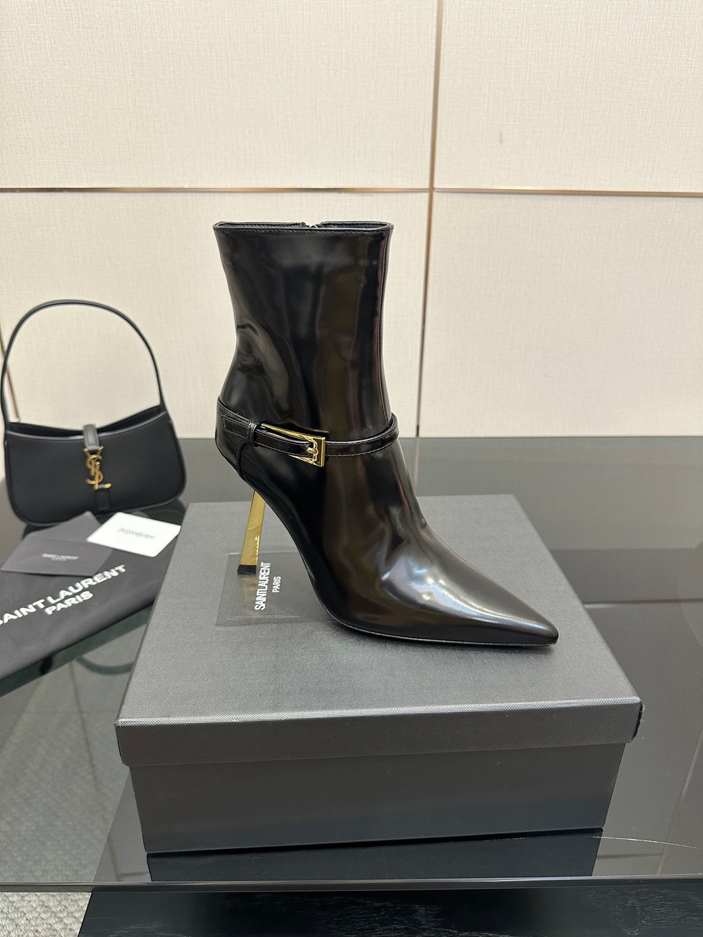 YSL ladies ankle boots, black glossy finish, gold buckle strap and stiletto heel