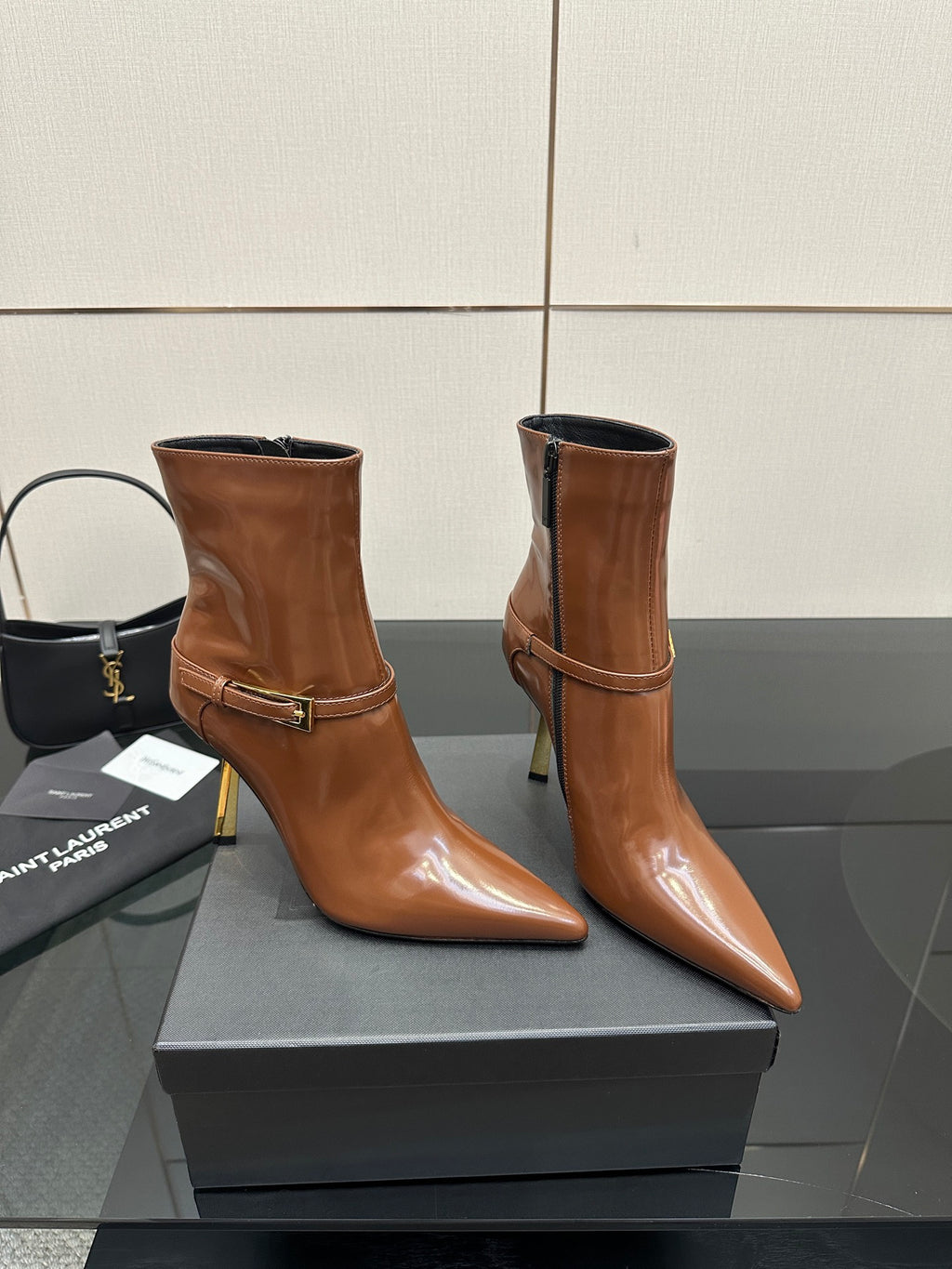 Women’s tan leather ankle boots, buckle strap, side zipper, high stiletto heel