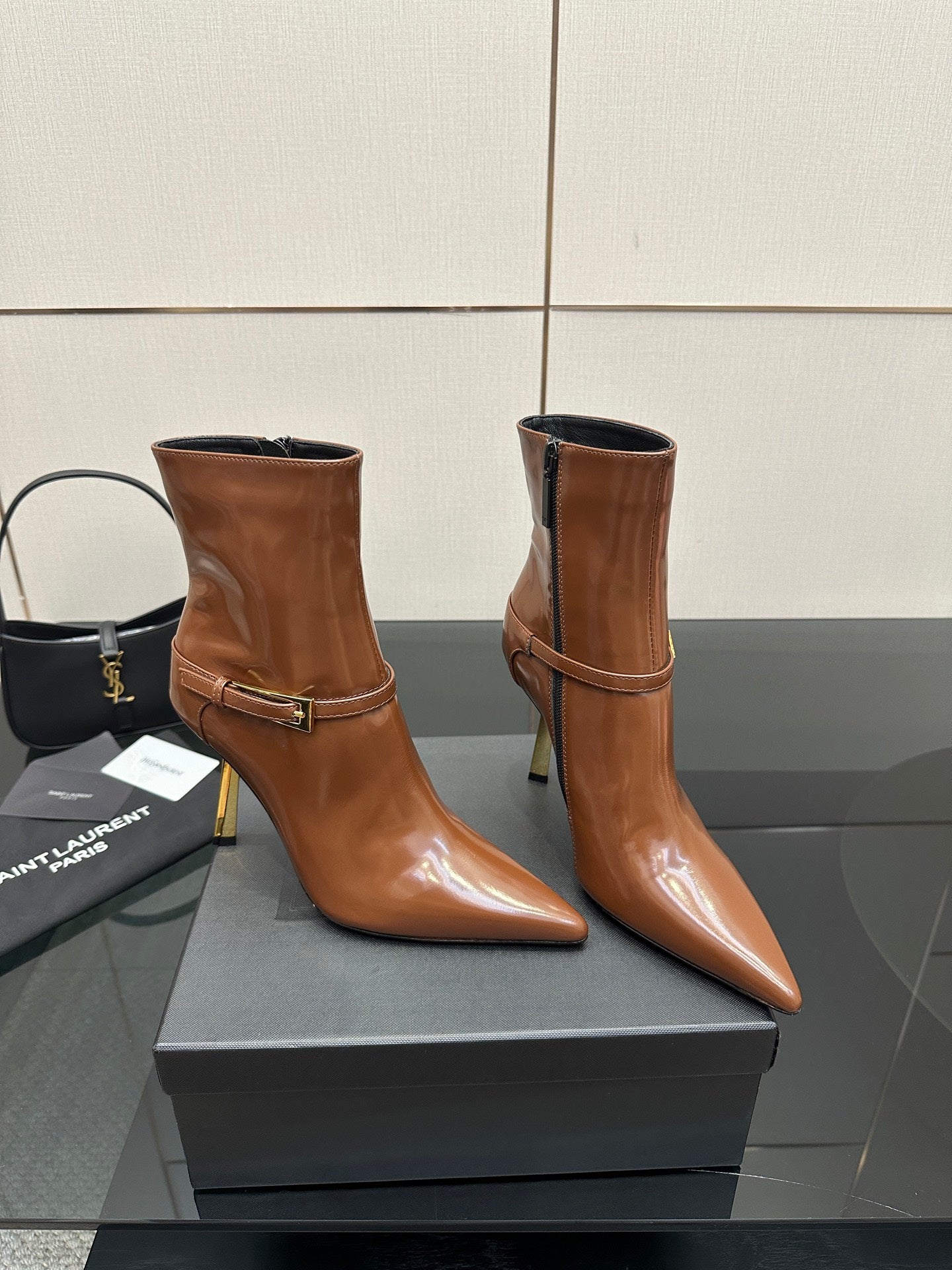 Women’s tan leather ankle boots, buckle strap, side zipper, high stiletto heel