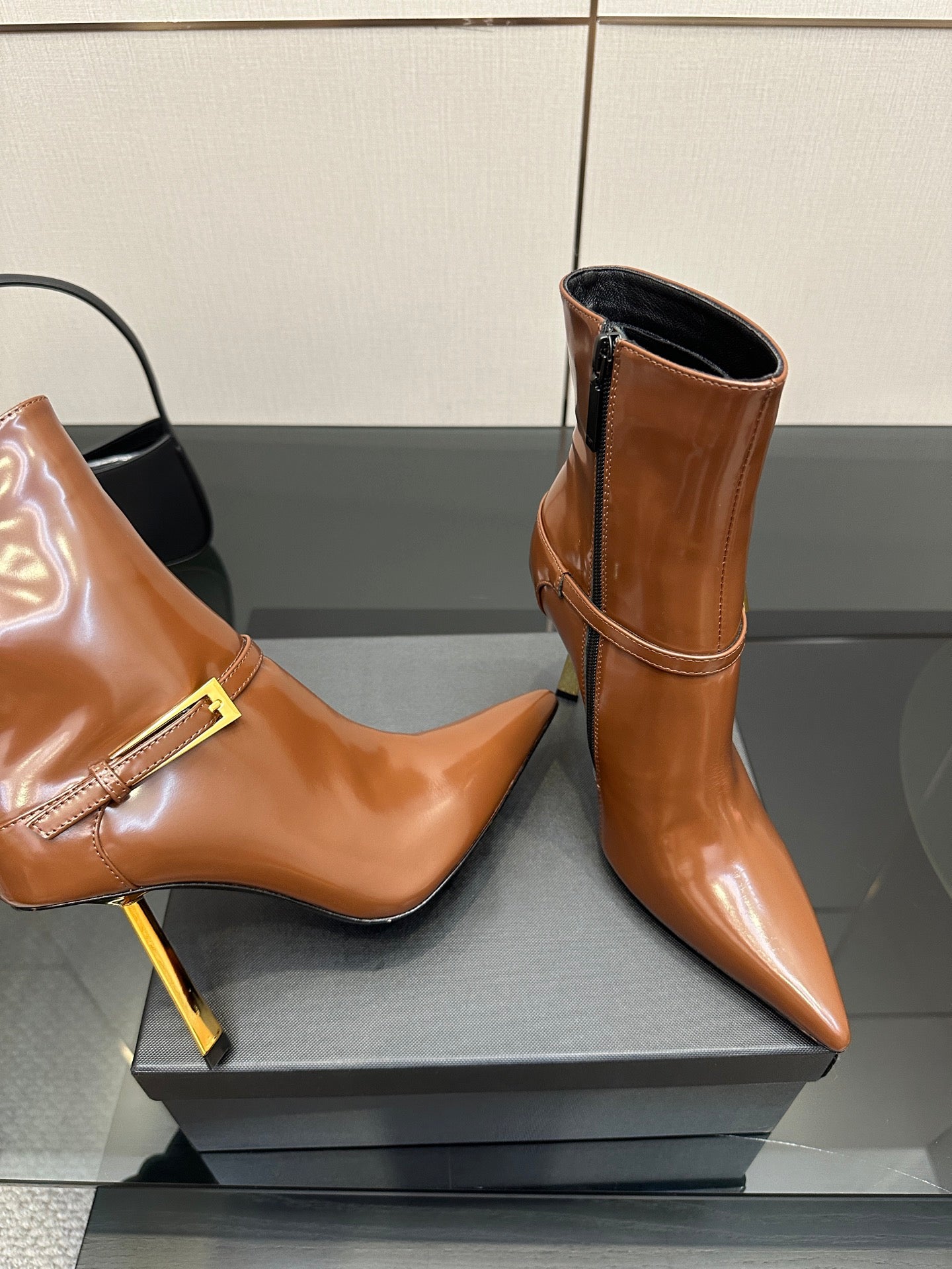 Women’s tan leather ankle boots, buckle detail, rounded curved toe, tall heel