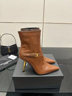 Women’s tan leather ankle boots, side zipper and gold buckle strap, stiletto heel