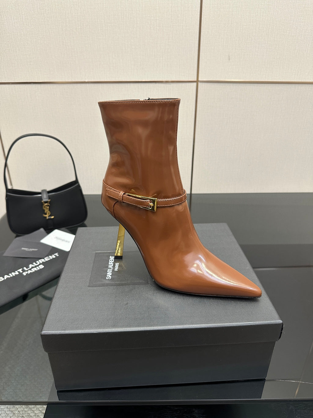 Women’s tan leather ankle boot, buckle strap, pointed toe, tall stiletto heel