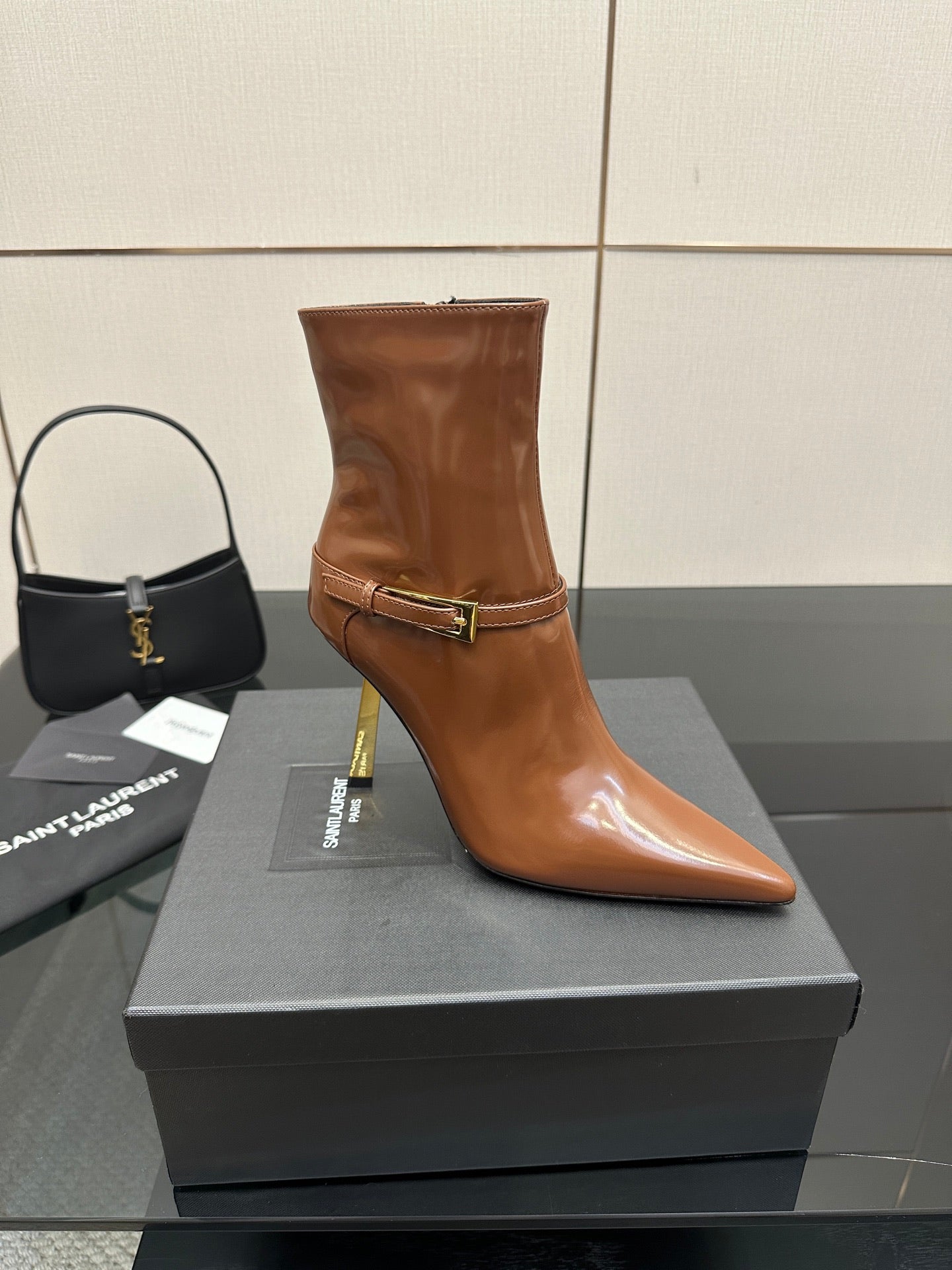 Women’s tan leather ankle boot, buckle strap, pointed toe, tall stiletto heel