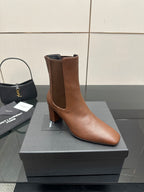 YSL ladies brown ankle boots, front angled view with elastic gore and block heel