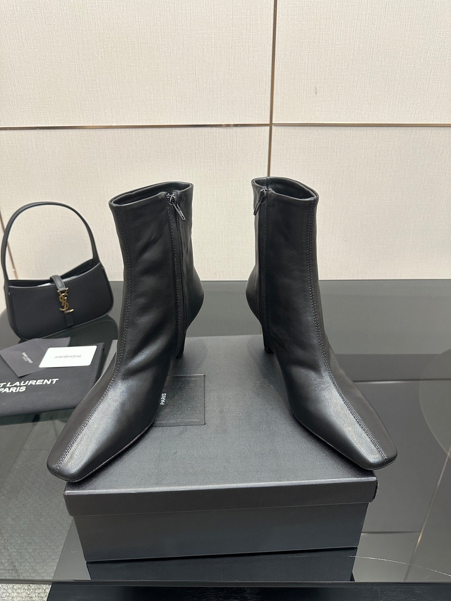 Black ankle boots with block heels shown from an angled view