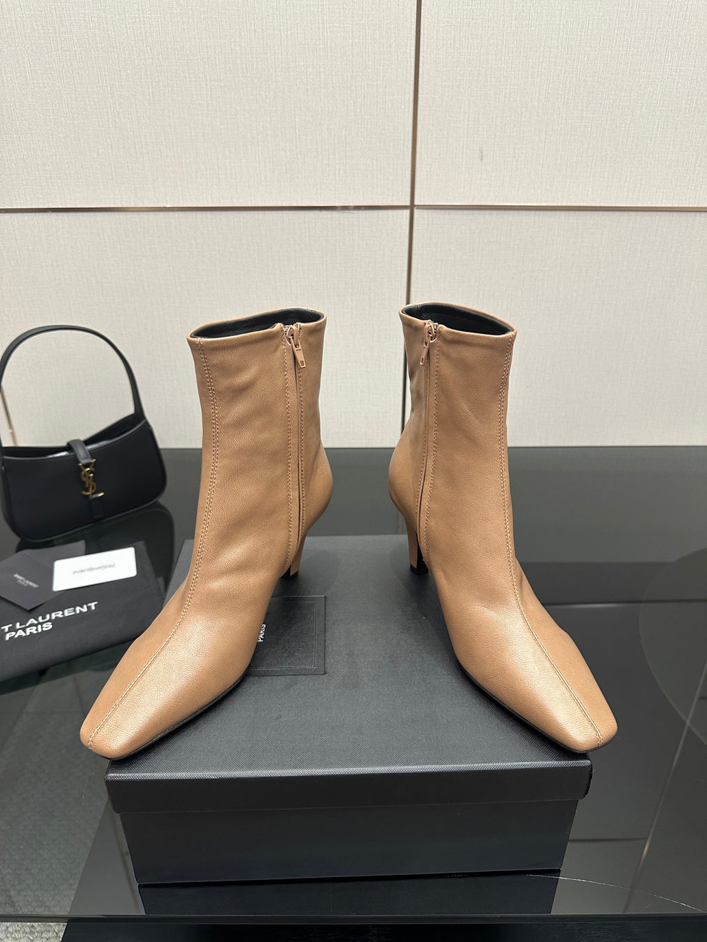 Beige ankle boots with pointed toe, slim high heel, zipper detail on box
