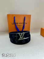 Louis Vuitton belt, dark navy monogram belt with silver LV buckle.