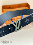 Louis Vuitton belt close-up, dark navy leather with monogram and silver buckle detail.