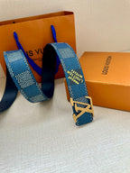 Blue Louis Vuitton belt with gold-tone LV logo buckle and textured strap.