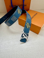 Blue Louis Vuitton belt draped with LV logo buckle and studded leather strap holes.