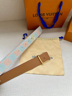 Louis Vuitton tan leather belt with gold buckle, shown with patterned strap.