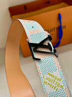 Louis Vuitton belt close-up: pastel blue patterned strap with black LV buckle detail.