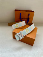 Patterned canvas belt with gold-tone LV buckle, light blue and cream geometric pattern