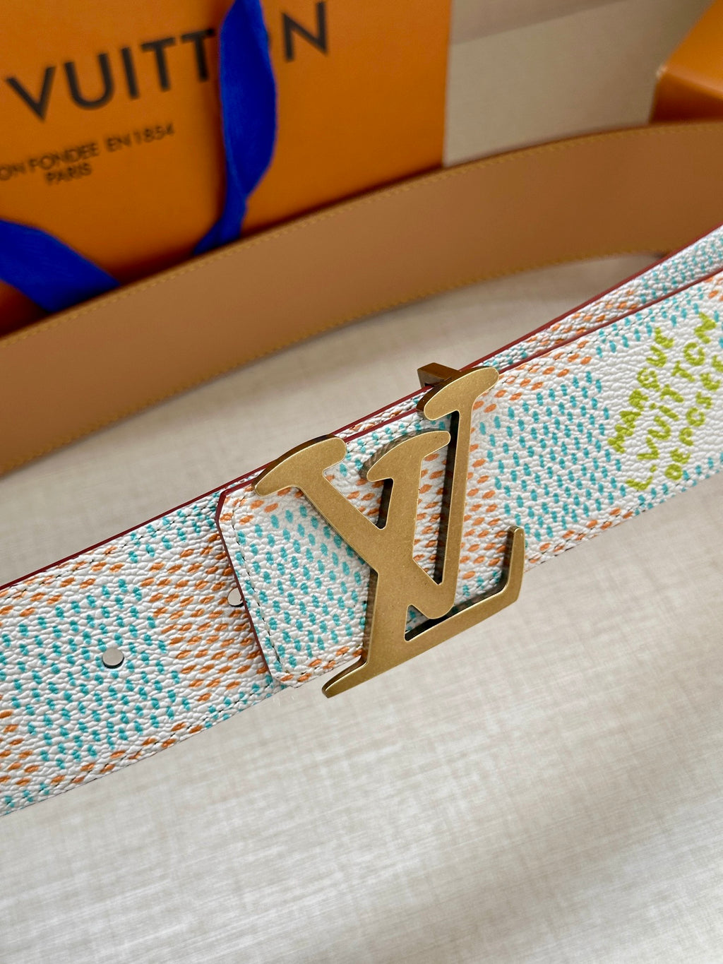 Patterned canvas belt strap with gold-tone LV buckle, light blue and multicolor check