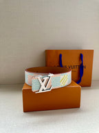 Patterned canvas belt with gold-tone LV buckle, light blue and cream geometric woven strap