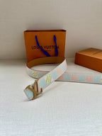 Patterned canvas belt with gold-tone LV buckle, light blue and cream geometric pattern