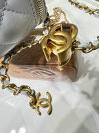 Gold-tone clasp and chain hardware on light blue Chanel bag