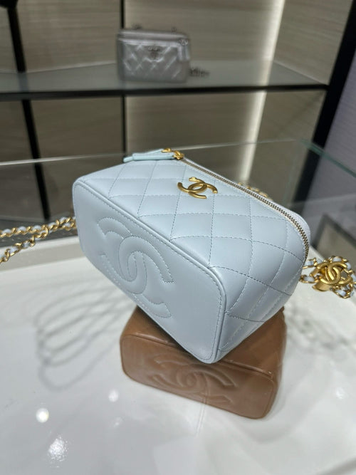Light blue quilted crossbody Chanel bag, angled view, gold-tone chain and zipper