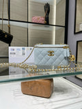 Light blue quilted crossbody bag with gold-tone chain and logo medallion