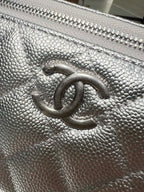Chanel silver pebbled leather bag front with embossed CC logo detail