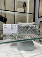 Chanel silver quilted chain crossbody bag with front flap and CC logo
