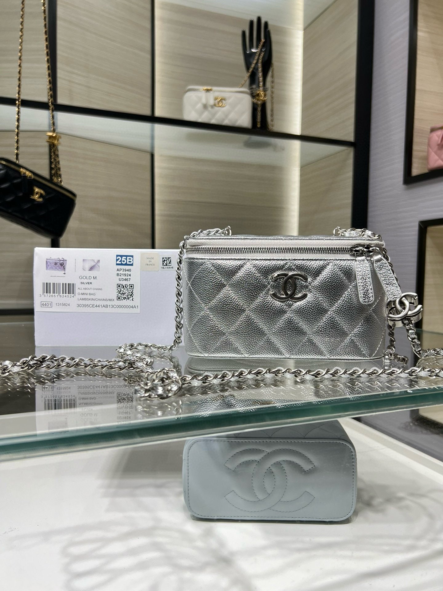 Chanel silver quilted chain crossbody bag with front flap and CC logo