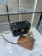 Chanel quilted mini crossbody bag with gold zipper and chain, black leather