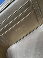 Chanel card slot detail on beige leather with stitched edges and CHANEL lettering