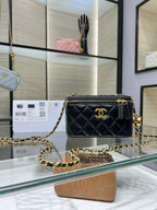 Chanel quilted mini bag with gold chain, front flap, and CC logo on dark leather