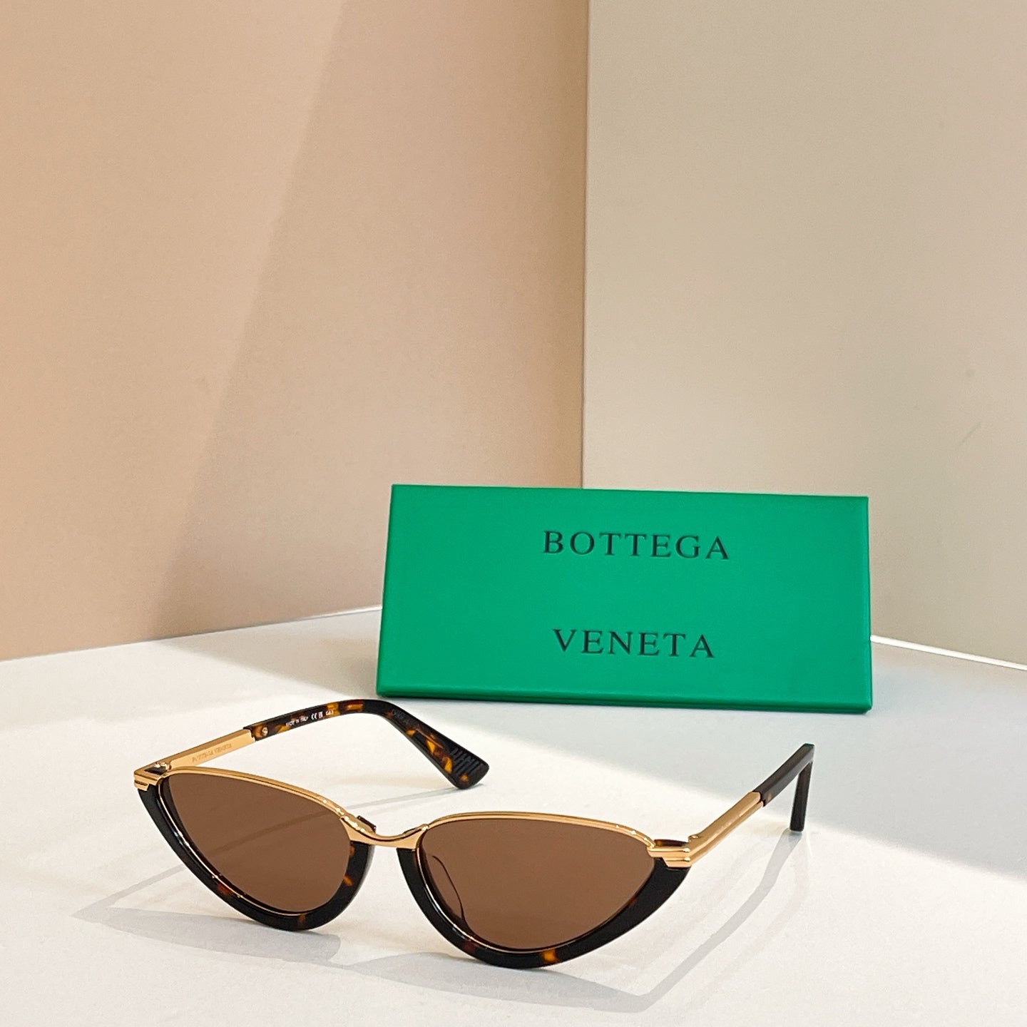 Bottega Veneta cat-eye sunglasses with amber lenses and tortoiseshell frames