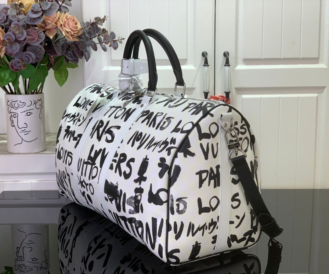 Louis Vuitton printed duffel bag, white with black logo pattern and black shoulder strap