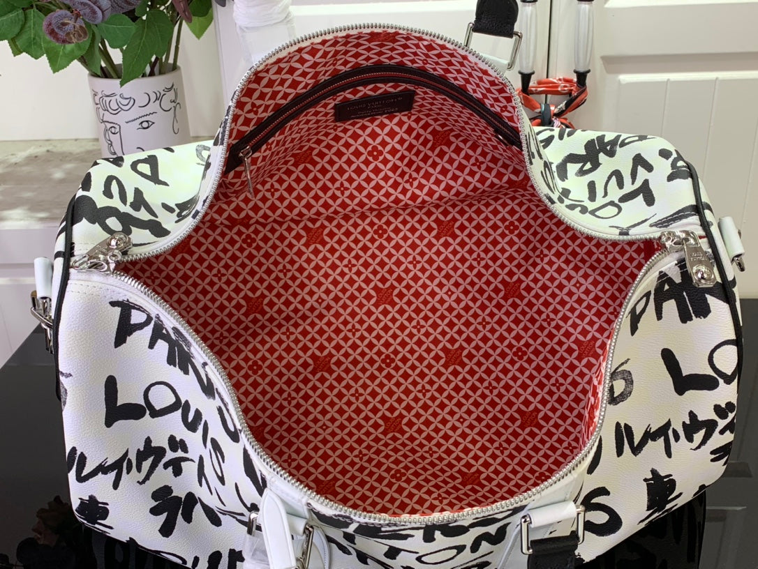 Louis Vuitton duffel bag interior with red lining and white zipper trim