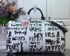 Louis Vuitton printed duffel bag with black handles and graffiti-style logo print