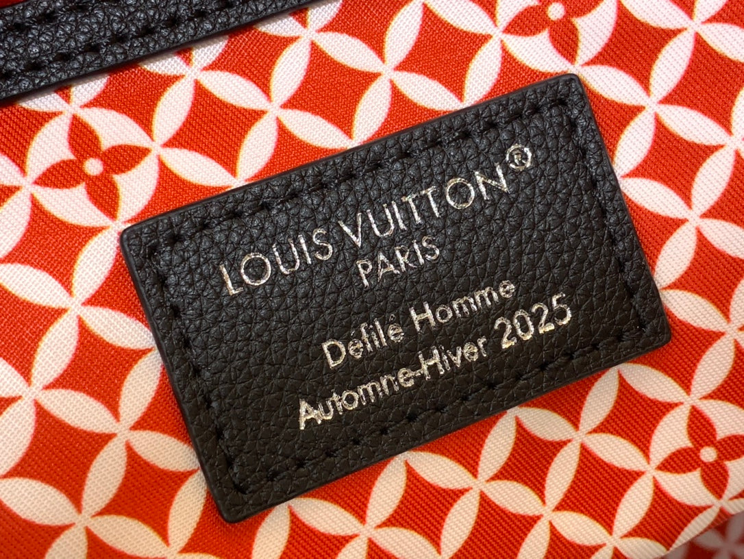 Louis Vuitton Paris luggage tag on orange patterned fabric with black text