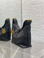 Set of three black leather quilted shoulder bags with gold-tone hardware