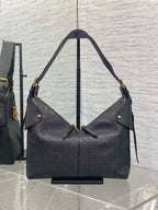 Dior quilted hobo bag with gold-tone hardware, angled shoulder straps, dark