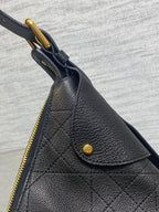 Dior quilted leather side with gold zipper pull and snap, dark