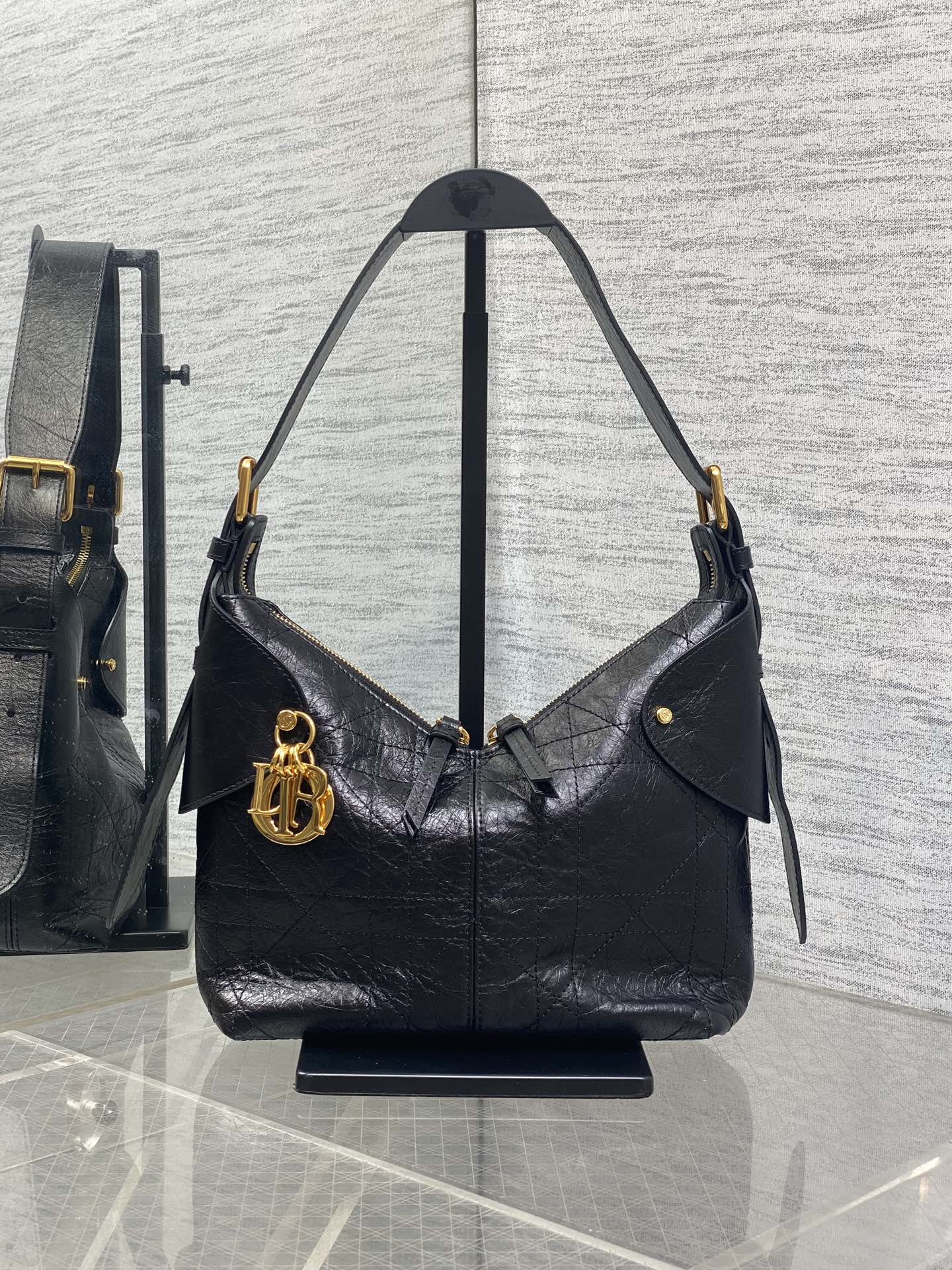Dior black leather shoulder hobo bag with gold hardware and top handles
